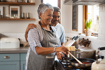 Image showing Love, cooking and old man with happy woman at stove in kitchen, embrace and healthy marriage bonding in home. Happiness, help and food in pan, senior couple with smile, hug and dinner in retirement.