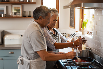 Image showing Cooking food, help and old couple in kitchen with smile, meal prep and frying at stove together. Love, senior woman helping elderly man prepare lunch in pan, retirement and dinner time in modern home