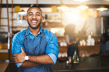 Image showing Coffee shop, happy barista and portrait of black man in cafe for service, working and crossed arms. Small business owner, restaurant and professional male waiter smile in cafeteria ready to serve