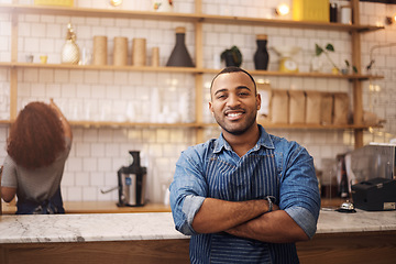 Image showing Coffee shop, crossed arms and portrait of black man in cafe for service, working and restaurant startup. Small business owner, professional barista and male waiter smile in cafeteria ready to serve