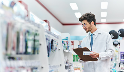 Image showing Pharmacist, medicine and man with a clipboard in pharmacy to check stock of products in retail store. Male person, pharmaceutical and medical industry for service, healthcare and inventory on shelf