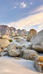 Image showing Rocks, beach and landscape with travel and environment, holiday destination in South Africa with nature and outdoor. Coastal location, natural scenery and fresh air, seascape and tropical adventure