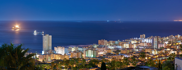 Image showing Cityscape, buildings and urban landscape at night, skyline and location with architecture, landmark and travel. City, skyscraper and banner with Cape Town view, rooftop and tourism with destination