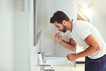 Image showing Dental, cleaning and brushing teeth with man in bathroom for habit, morning routine and oral hygiene. Smile, cosmetics and health with person and toothbrush at home for self care, breath and mouth