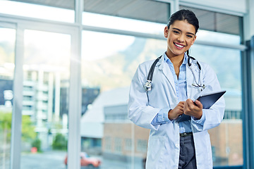 Image showing Portrait, doctor and smile of woman with tablet in hospital for research, telehealth or healthcare. Face, happiness and female medical professional with touchscreen tech for online wellness in clinic