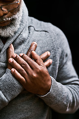 Image showing Hands on chest, heart attack and senior black man with medical emergency in studio isolated on a background. Pain, cardiology and African male person with cardiac arrest, heartburn or stroke problem.