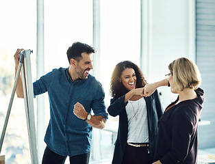 Image showing Brainstorming, fist bump and happy business people celebrate success, teamwork achievement or innovation. Whiteboard, winner and excited team, management or group celebration for planning development