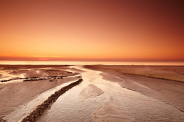 Image showing Sunset sky, beach sand and landscape, nature and travel, environment and coastal location in Denmark. Mockup space, seaside destination and ocean view, outdoor and natural scenery with orange horizon