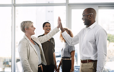 Image showing High five, support and motivation with business people in office for success, winner and agreement. Partnership, goals and target with group of employees for teamwork, collaboration and solidarity