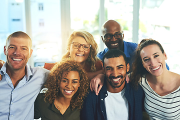 Image showing Business people, hug portrait and happiness in office with a friends smile from teamwork and collaboration. Diversity, trust and creative staff together feeling proud from job motivation and success