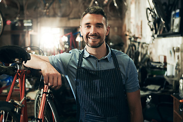 Image showing Portrait, smile and repair man in bicycle shop working in store or cycling workshop. Face, bike mechanic and confident male person, business owner or mature professional technician from Australia.