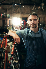 Image showing Serious, portrait and repair man in bicycle shop working in store or cycling workshop. Face, bike mechanic and confident male person, business owner or mature professional technician from Australia.