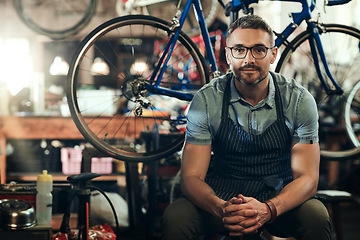 Image showing Portrait, mechanic and man in bicycle shop, store and cycling workshop for repairs. Entrepreneur, bike technician and mature male person, small business owner and retail service expert from Canada