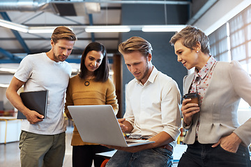 Image showing Business people, startup team and laptop with talking, planning and brainstorming together in office. Leader man, computer and teamwork with reading, focus and consulting at web design company