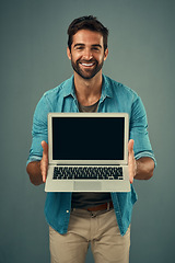 Image showing Happy man, laptop and portrait with mockup screen for advertising or marketing against grey studio background. Male person showing technology or computer display or mock up space for advertisement