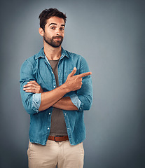 Image showing Point, hands and portrait of man in studio on gray background for announcement, news and information. Fashion, mockup space and male person with pointing hand sign for promotion, choice and decision