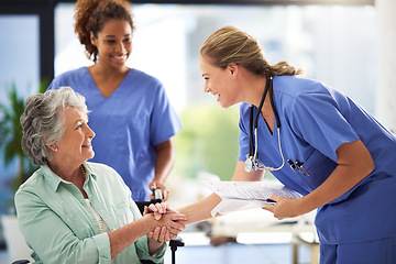 Image showing Handshake, nurse smile and senior woman in wheelchair with medical results and surgery success news. Hospital, healthcare and clinic with women and nursing staff with care and help of elderly person