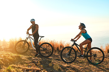 Image showing Happy couple, workout and cycling in the mountains for fitness and exercise together. Bike, wellness and young people with outdoor adventure and sports training with happiness and freedom mockup