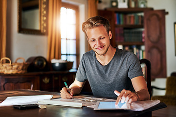 Image showing College research, studying and a man with a tablet for home work, education and elearning. Smile, working and a male student with technology for information and planning for a project in a house