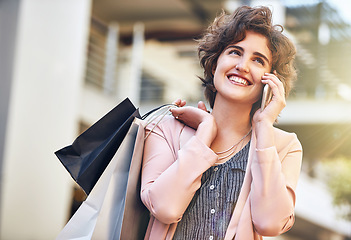 Image showing Woman, phone call and city with shopping bags, sale and happiness for discount on walk in summer. Girl, retail deal and fashion with smartphone in metro cbd with communication, promotion and clothes