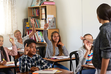 Image showing Question, teacher and hands of children in classroom for answer in lesson, learning and education. Child development, school kids and young students with hand up for asking, feedback and knowledge