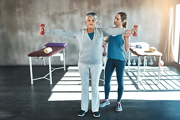 Image showing Physical therapy, dumbbell and coaching with old woman and personal trainer for support, health and physiotherapy. Training, weightlifting and fitness with senior patient and female trainer for help