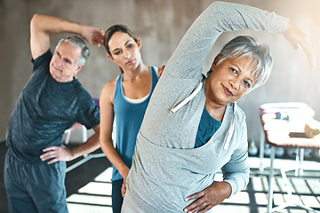 Image showing Stretching, physical therapy and old woman with personal trainer in class for fitness, wellness or rehabilitation. Health, workout or retirement with senior patient and physiotherapist for warm up