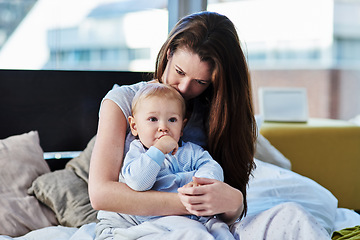 Image showing Mother, baby and sad with depression at family home due to mental health and is frustrated. Child, mom and postpartum with worry and anxiety at home with insomnia has love for children development.