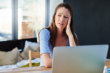 Image showing Headache, home office and woman with stress working on a freelance project with a laptop. Burnout, remote work and female freelancer with migraine in pain doing research at desk or workspace at house