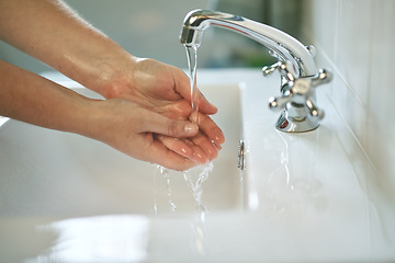 Image showing Clean, bathroom and hands with water for wash or dirt, bacteria and safety from germs at home. Woman, cleaning and hand for self care for healthy person for disinfection and hygiene at the house.