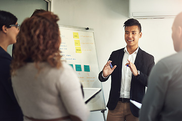 Image showing Presentation, businessman with a chart and planning in a modern workplace office together with a lens flare. Teamwork or collaboration, data review or ideas and diverse coworkers in a workshop