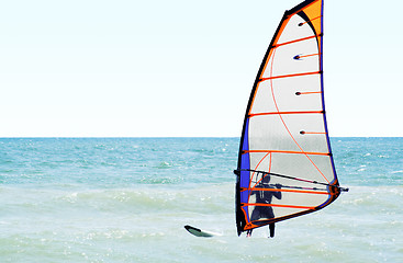 Image showing Silhouette of a windsurfer on the sea in the afternoon