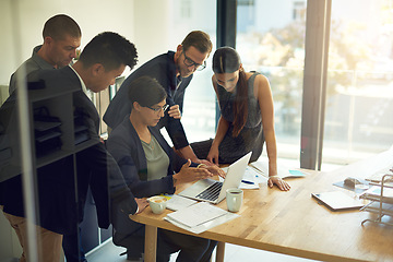 Image showing Business meeting, laptop and group of people with website review, online launch and discussion or teamwork. Corporate, professional or women and men reading, check or planning on computer in office