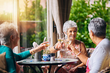 Image showing Cheers, wine glasses and senior women or friends in retirement, reunion or social celebration, success and happy. Champagne, celebrate and elderly people or customer toast, restaurant and hospitality