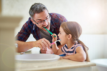 Image showing Kid, father and brushing teeth in bathroom, bonding and cleaning together. Dad, girl and toothbrush for dental hygiene, oral wellness or health for happy family care, teaching and learning at home.