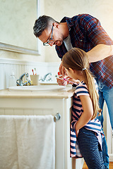 Image showing Father, girl and brushing teeth in bathroom, bonding and cleaning together. Dad, child and toothbrush for dental hygiene, oral wellness or healthy tooth for family care, teaching and learning in home