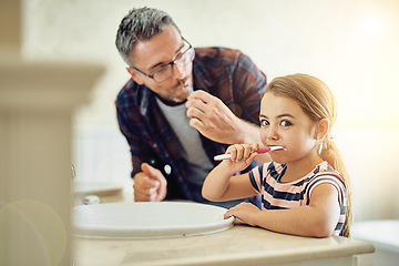 Image showing Portrait of child, father and brushing teeth in bathroom, bonding and cleaning together. Dad, girl and toothbrush for dental hygiene, oral wellness or health for family care, teaching and learning.