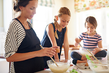 Image showing Mother, family or kids baking in kitchen with siblings learning cookies recipe or mixing pastry at home. Girl, mom cooking or baker helping or teaching children to bake together for child development