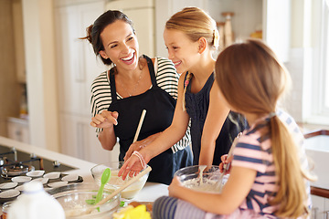 Image showing Mom, happy family or children baking in kitchen with siblings learning cookies recipe or mixing pastry at home. Laughing, funny or mother helping or teaching kids to bake together for cooking skills