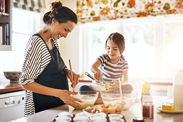 Image showing Mother, cooking or happy girl baking in kitchen as a family with a young kid learning cookies recipe at home. Cake pastry, baker or mother helping or teaching daughter to bake for child development