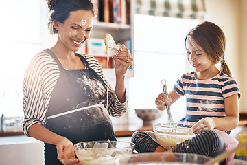 Image showing Mother, playful or kid baking in kitchen as a happy family with an excited girl laughing or learning cookies recipe. Smile, flour or funny mom helping or teaching kid to bake for development at home