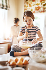 Image showing Fun, mixing flour or girl baking in kitchen for cookies pastry or cooking recipe preparation at home. Bowl, playful or young child learning to bake for skills development or independence in a house