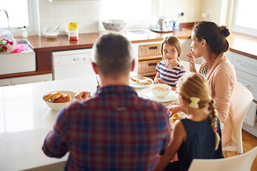 Image showing Happy family, morning and eating breakfast on kitchen for meal or bonding time together at home. Mother, father and children with healthy food to start the day for nutrition or cereal in the house