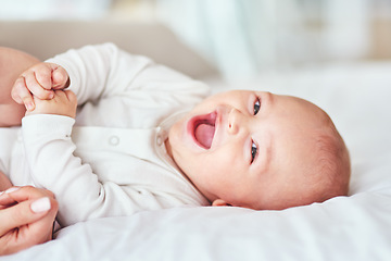 Image showing Laugh, portrait and a baby on the bed with mother for play, bonding and wake up in the morning. Smile, house and a little newborn child in the bedroom for happiness, care and together with mom