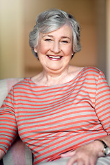 Image showing Home, happy and portrait of a senior woman with a smile for retirement and old people happiness. Relax, lounge and an elderly lady in a chair in the living room with confidence and comfort in morning