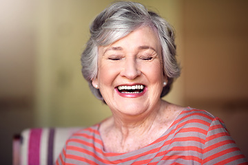 Image showing Happy, senior woman and eyes closed in nursing home, living room or laughing in house or relax in retirement. Elderly lady, happiness and smile or laugh at funny, joke with freedom of retired person