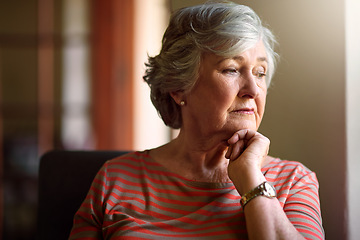 Image showing Senior woman, worry and thinking at window with memory, ideas and home on living room sofa. Elderly lady, remember and think with decision, depression and retirement on lounge chair, house and fear