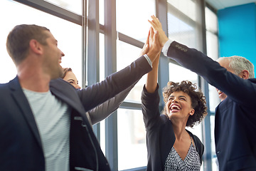 Image showing Business people, group high five and celebration in office with team, smile and support for company goals. Men, women and hands in air for teamwork, achievement and motivation at insurance agency