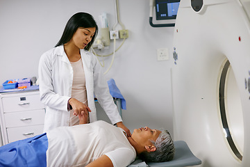 Image showing Mri, doctor and woman holding hands of patient in hospital before scanning in machine. Ct scan, comfort and medical professional with senior female person in radiology test for healthcare in clinic.