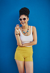 Image showing Sunglasses, fashion and portrait of woman on blue background, wall and summer streetwear, trendy clothes or shades mockup. Girl, happy and excited model with cool style, vision and urban mock up